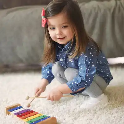a girl playing with cubes 